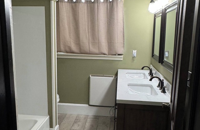 All one floor Charming large 2 bedroom, LR, sunroom, kitchen 2 baths wt laundry.