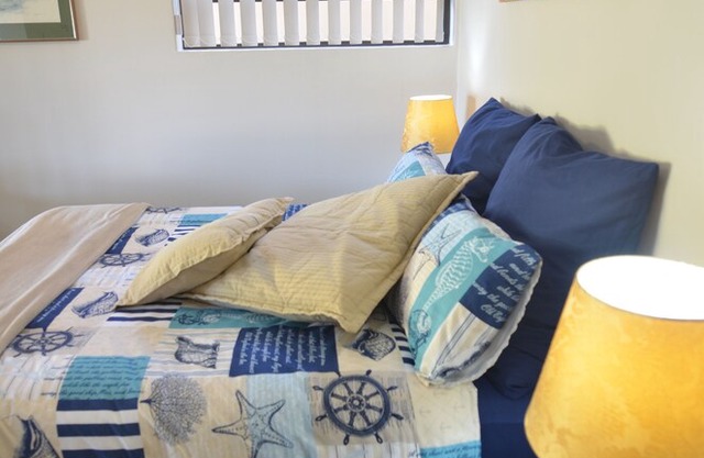 Apartment in large tropical garden with pool and sea view