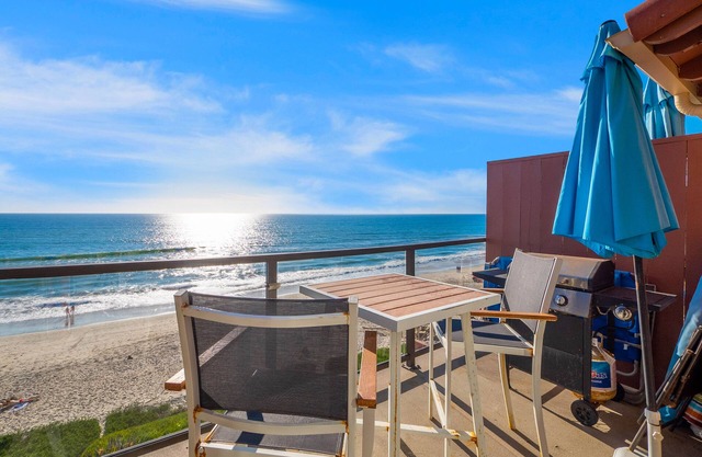 Beachfront condo with balcony & deck