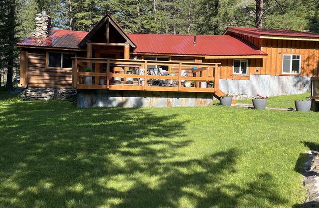 Beautiful cabin with a creek running through it.