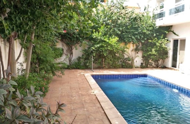 Beautiful villa with pool and amenities .