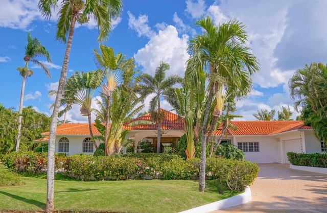 Breathtaking Villa Overlooking Golf Course Within Walking Distance to Beach