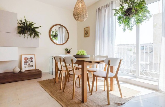 Bright and stylish 2-bedroom apartment in the heart of Mellieha, Malta. Located in a quiet residential area, it features a charming louvered balcony, large sunlit windows, and modern interiors with natural touches
