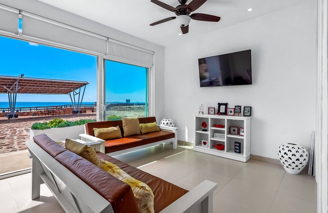 Bright dog-friendly villa with beach views, private patio, outdoor pool, kitchen