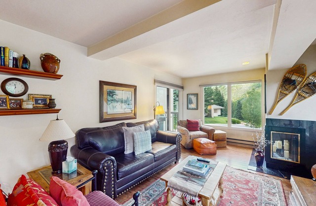 Bright mtn-view condo with hot tub, game room, pool, balcony, grill, fireplace