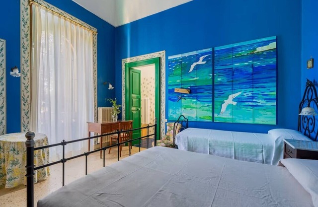 Charming traditional villa in Salento, Puglia, Italy, surrounded by vineyards.