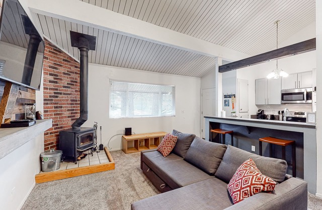 Charming, two-story ski condo w/a wood stove, free WiFi, shared pool, & hot tub