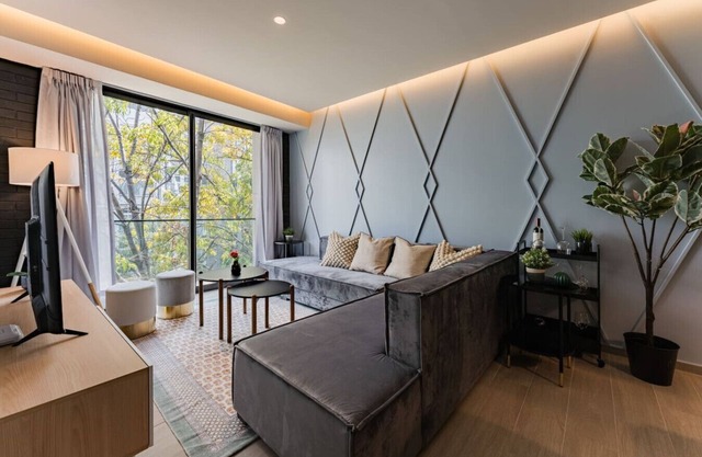 Chic Apartment with Tree-Lined Balcony Views & Parking