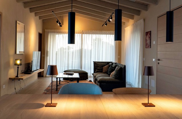 Clifftop design villa with infinity pool facing the sunset