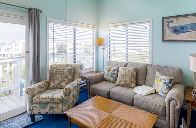 Colorful, lofty condo with balcony, beach access, pools, hot tubs & tennis