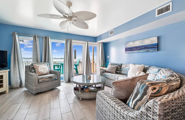 COME AND ENJOY this beautifully decorated beachfront townhome where you can soak up the sun!