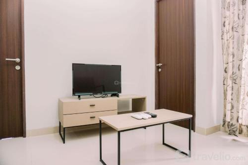 Comfort and Homey 2BR at Transpark Bintaro Apartment By Travelio