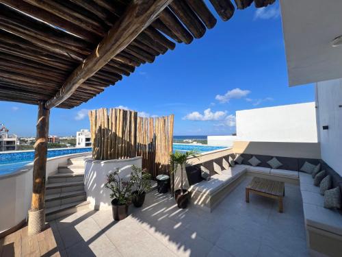Condo Boho con Roof pool y vista al mar