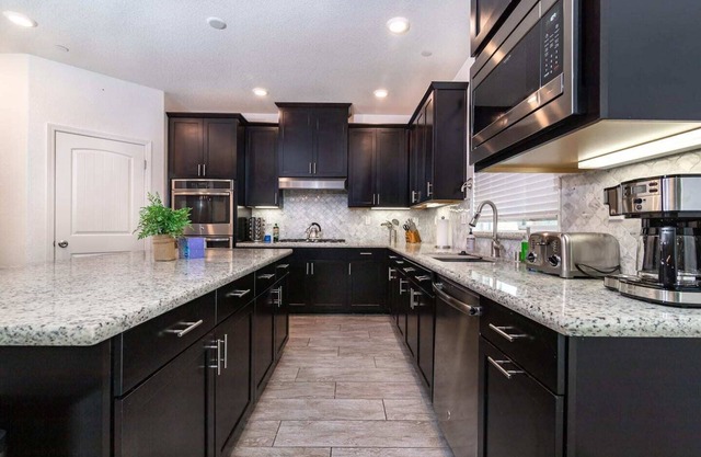 Contemporary pool house with a back yard Oasis