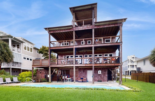 Custom home on the Intracoastal with water views, pool, dock, & decks