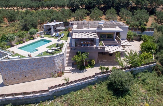 Deluxe villa with a garden, a terrace and a private, heated pool, in a unique nature landscape with a wonderful sea view