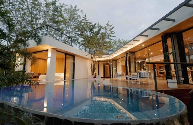 Discover the essence of tropical living at Casa Las Abejas, a stylish villa with a private pool, spacious design, and lush surroundings.