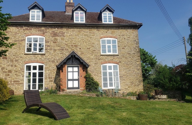 Dog friendly 7 bed farmhouse near Malvern Hills with huge hot tub and games room