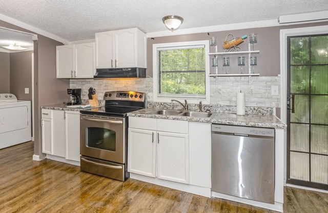 Dog-friendly home in a prime location with a yard, patio, washer/dryer, and AC