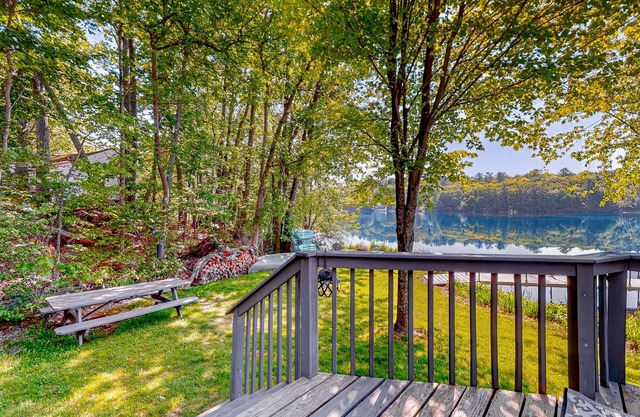 Dog-friendly pond-front cottage with deck, grill, firepit, water view, fast WiFi