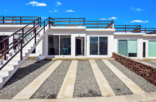 Dog-friendly retreat with ocean-view rooftop deck, pool, hot tub, & kitchen