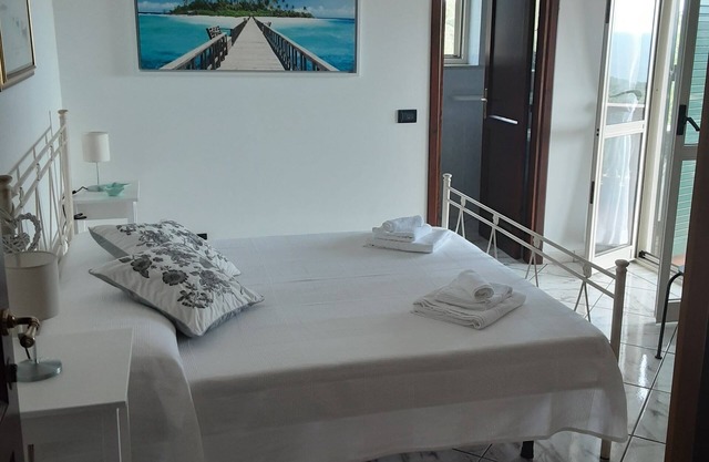 Double room with bathroom, small terrace with sea view