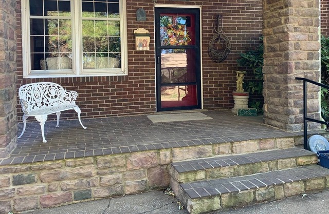 Early 1800 farmhouse sitting in the middle of beautiful farmland.