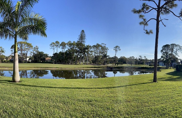 Enjoy stunning lake & golf views from this renovated 2/2 ground flr corner condo