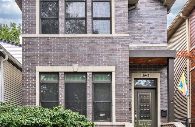 Entire Home in Historic Logan Square with private backyard, parking available.