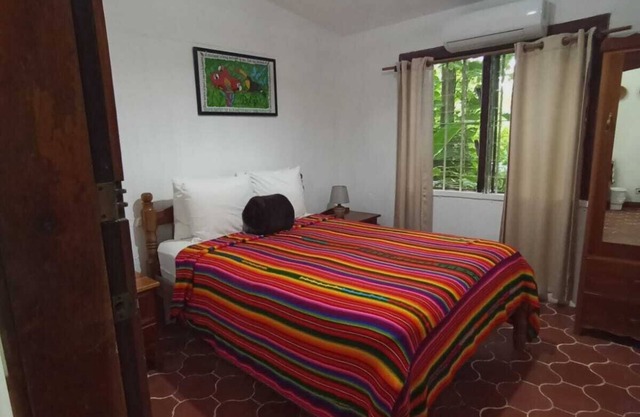 Experience comfort and relaxation in our air-conditioned apartment, featuring two spacious bedrooms, a welcoming living room, a fully equipped private kitchen, and a well-appointed private bathroom. Perfect for families or groups.