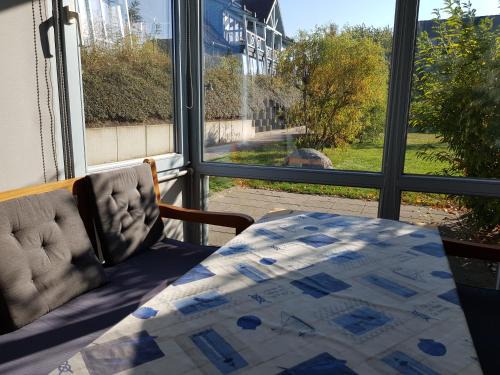Ferienwohnung 4 im Haus am See mit Wintergarten und Terrasse