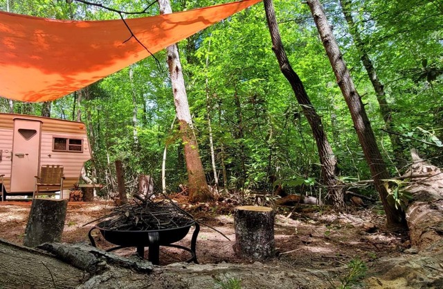 Foraging Orange vintage 60's camper near Rafting