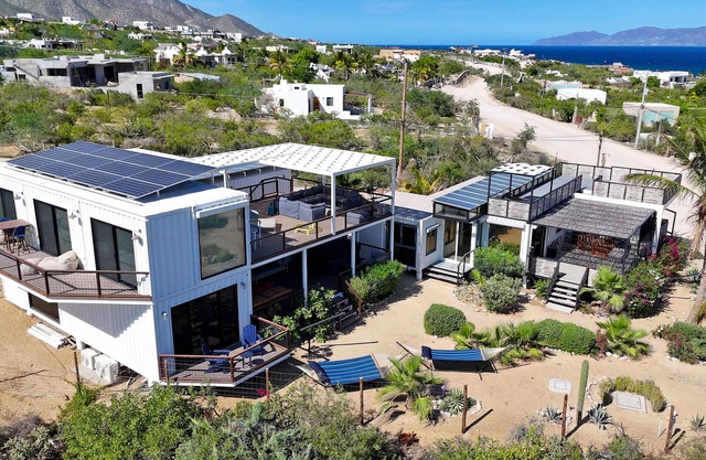 Funnest house in Baja! Game nights w/smart darts, shuffleboard, & video games. Enjoy a new 8 person hot tub, lounge on multiple decks w/firepits, fast Wifi (250 mb+)w/Starlink backup. Use of 2 SUPs. Daily housekeeping optional.