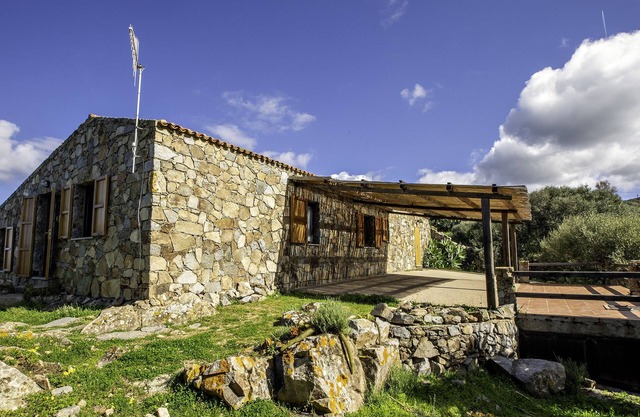Gallurese stazzu in the countryside with sea view above Li Feruli
