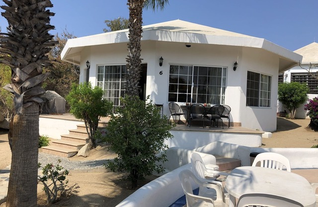 Gorgeous house in a neighbourhood surrounded by palm trees.