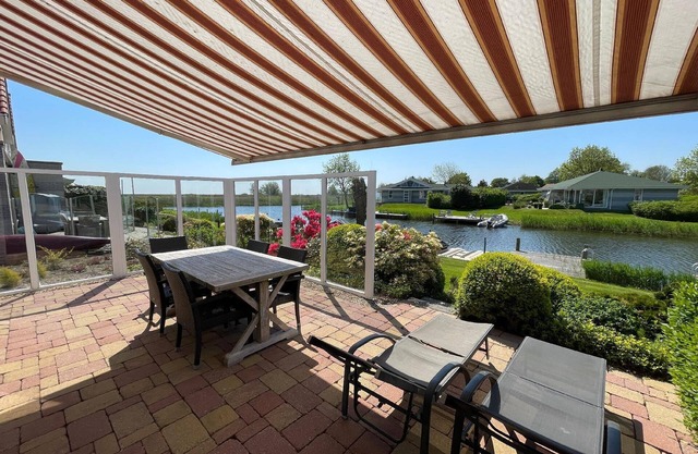 Holiday home in Makkum Terrace and sauna