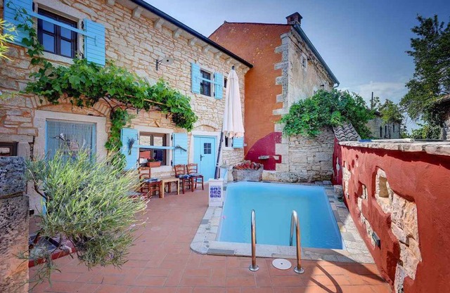 Holiday home with outdoor swimming pool