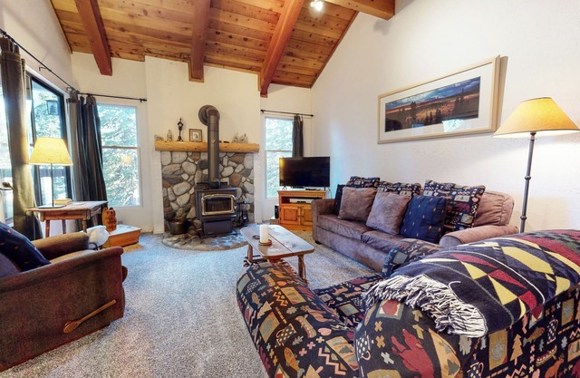 Homey Condo, Right Across from The Village! Forested Setting & Balcony