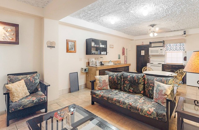 Homey suite in town w/WiFi, partial AC, shared pool & veranda - walk to beach