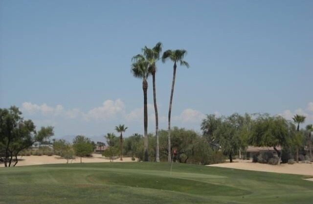 House Right on the 12th Green at Desert Springs Golf Course with Amenities