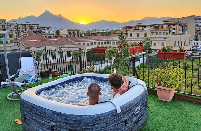 In the center bright large room, en-suite bathroom, shared terrace and kitchen