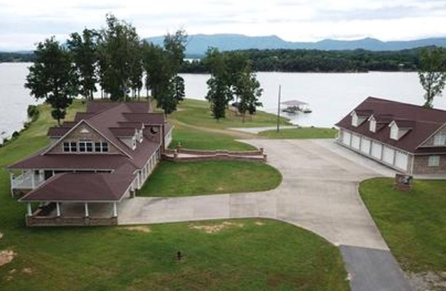 "LAKE HOUSE" On 7 Acres Of Douglas Lake With A Private Boat Ramp & Private Dock!