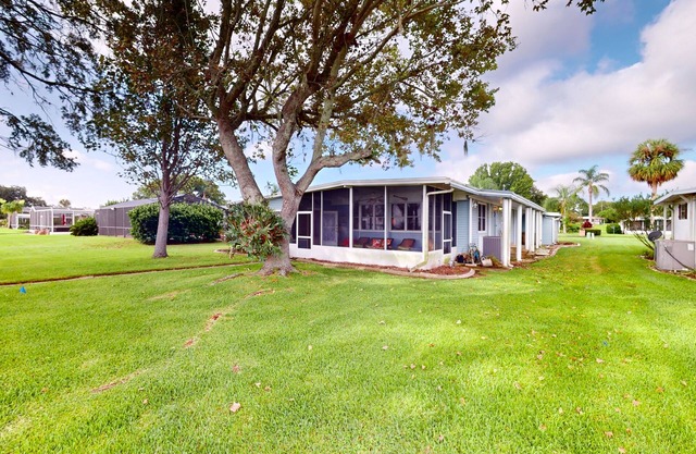 Lakefront home with al fresco dining, dock, office, expansive interior, & W/D