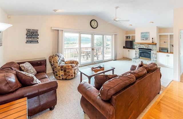 Lakefront home with free attraction tickets, deck, hot tub, and pool table