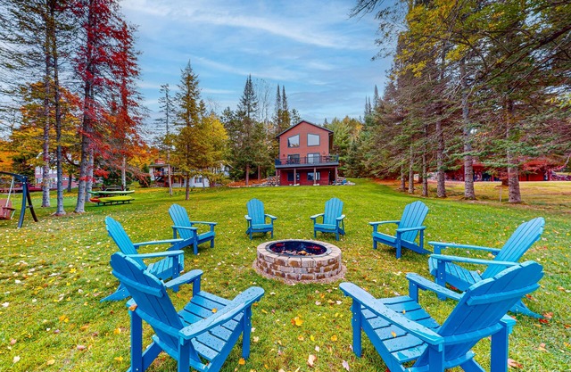 Lakefront home with yard, private dock, deck, firepit, & washer/dryer