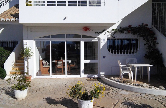 Large 2-bed 2-bath ground-floor apartment; communal pool, close to village/beach