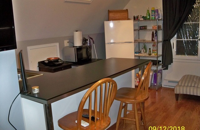 Loft Apt is above a detached Garage. Full bathroom, kitchenette, fridge, A/C