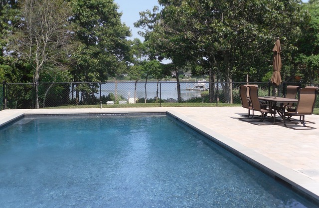 Lovely home by the sea with dock and heated Gunite pool!