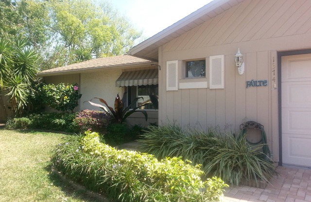 Lushly Landscaped Pool home Offers Tranquil Setting Yet Close to Beach