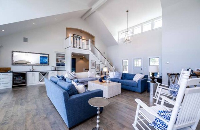 Luxury lakefront home w/heated saltwater pool, cabana at top of beach stairs